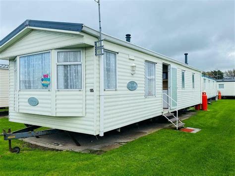 Decking to the outside. . Cheapest static caravan site fees in north wales